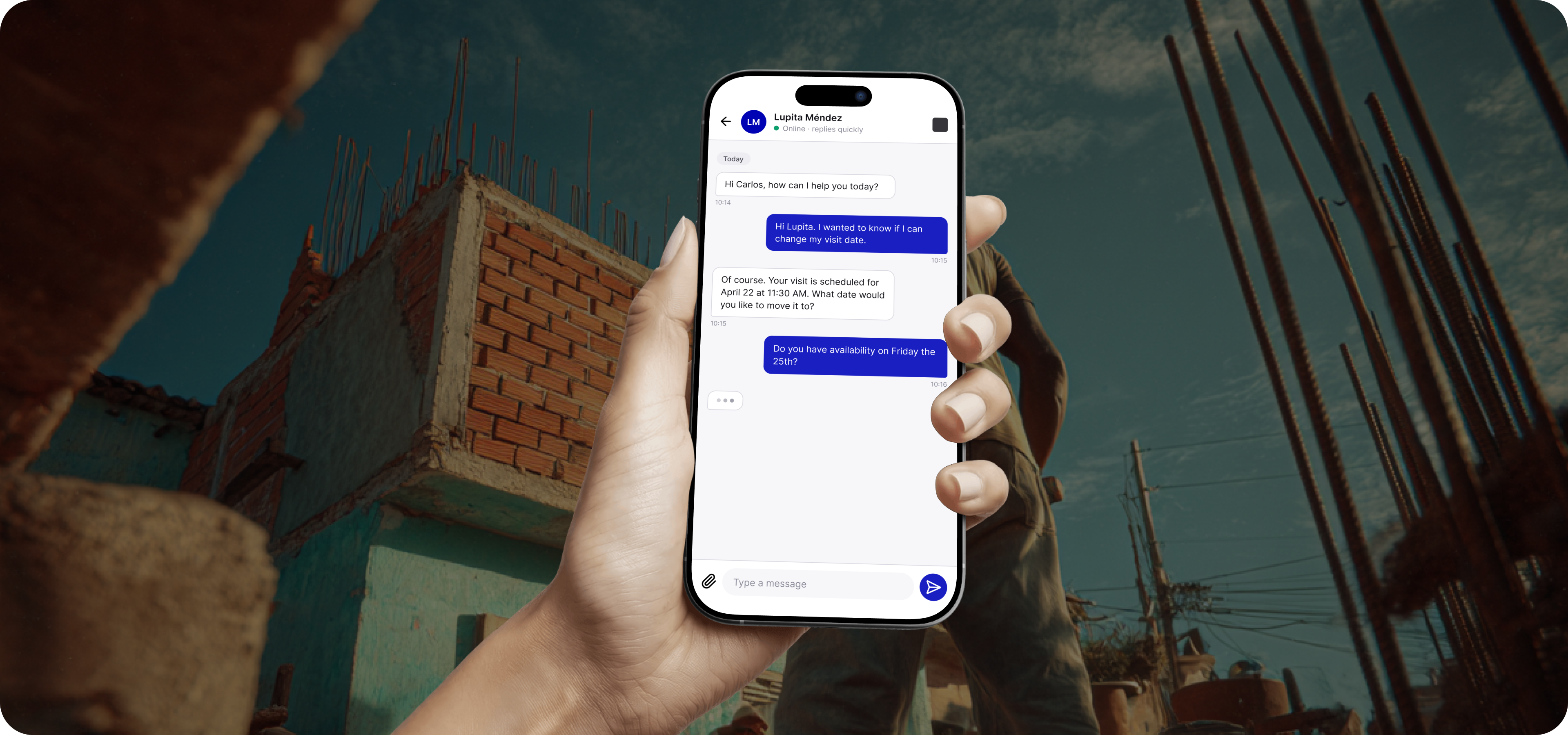 Patrimonio Hoy — hand holding phone showing chat interface with a socio scheduling a visit